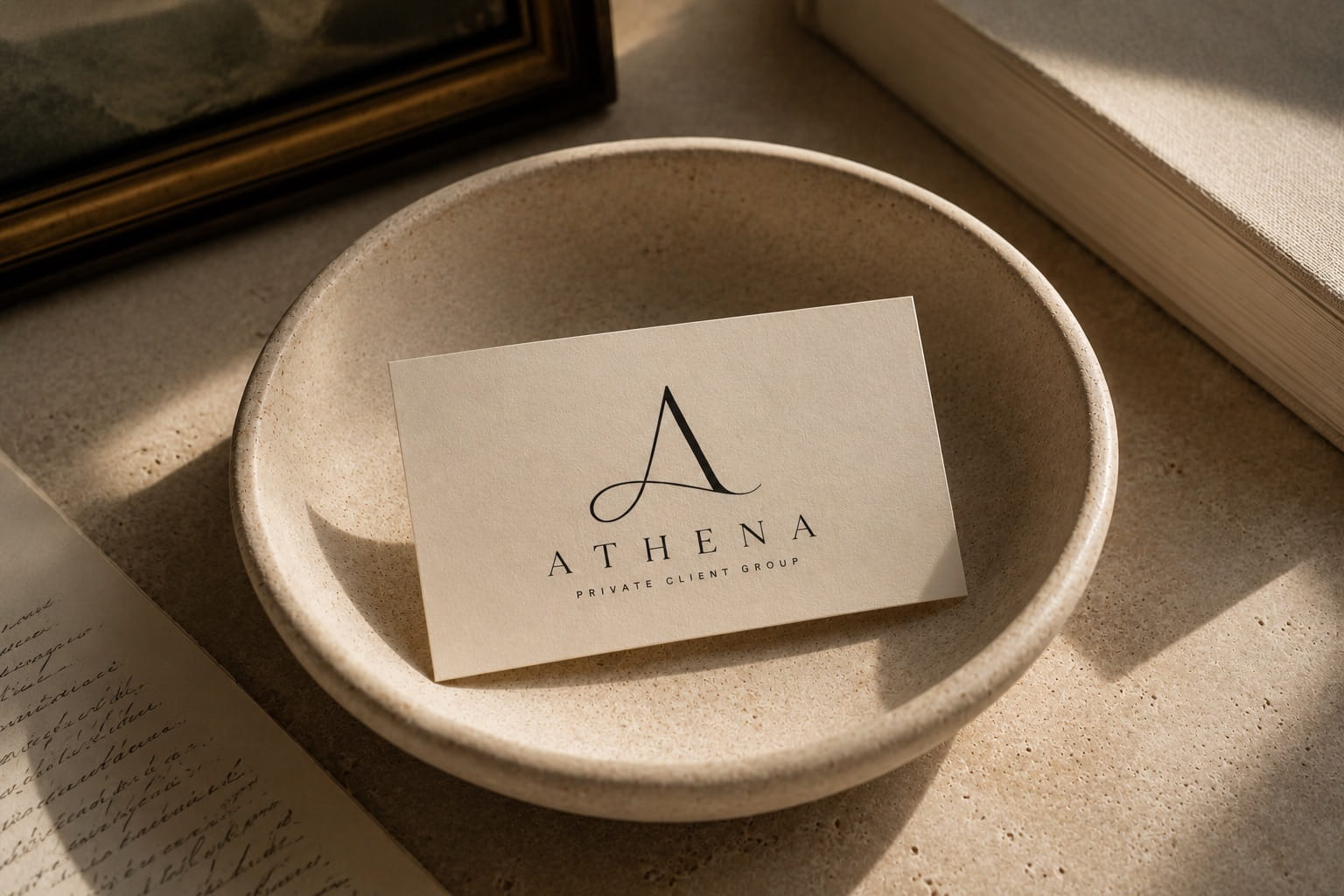 Photo of an Athena business card placed in a bowl